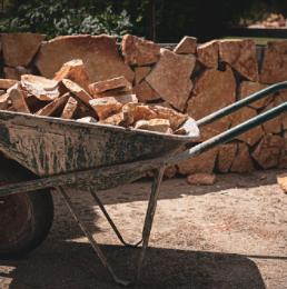 picture of wheelbarrow carrying rocks