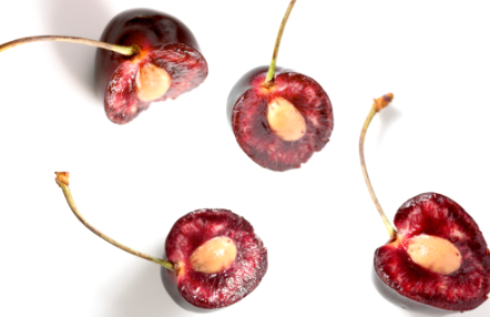 Barbados cherries cut in half with their seeds exposed