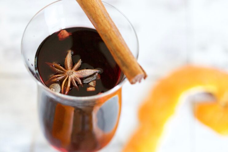 Picture of star anise dipped in a black liquid